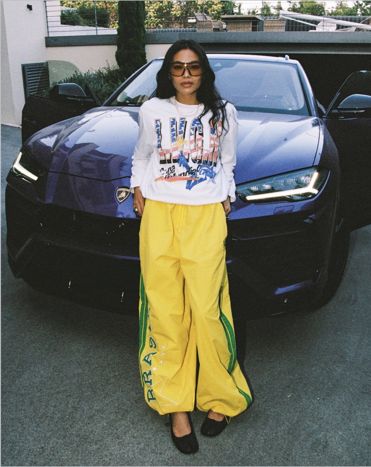 LVGN lifestyle image with model in front of a car